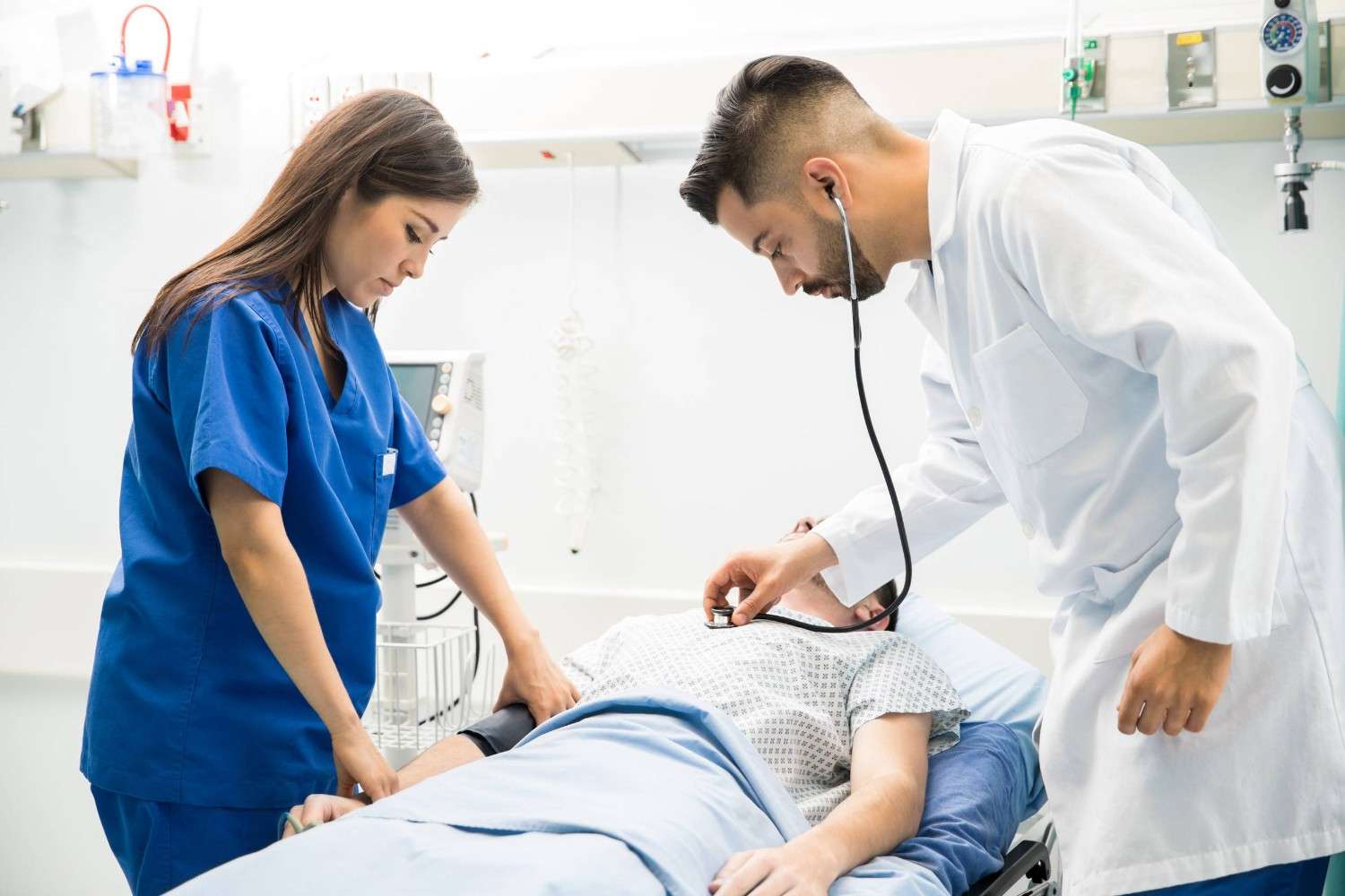 A Doctor And A Nurse Examining A Patient
