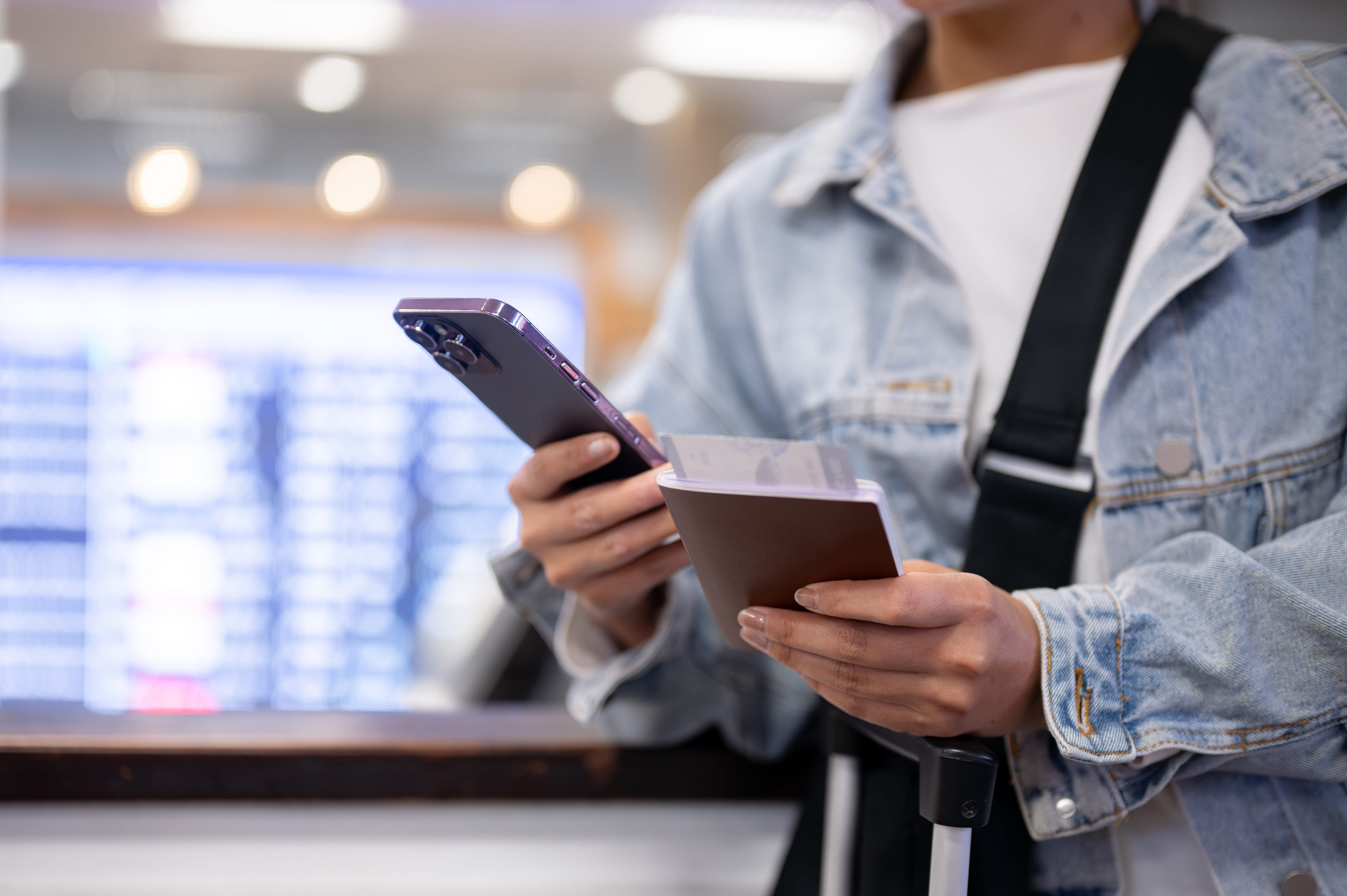 Airport passenger checking flight details