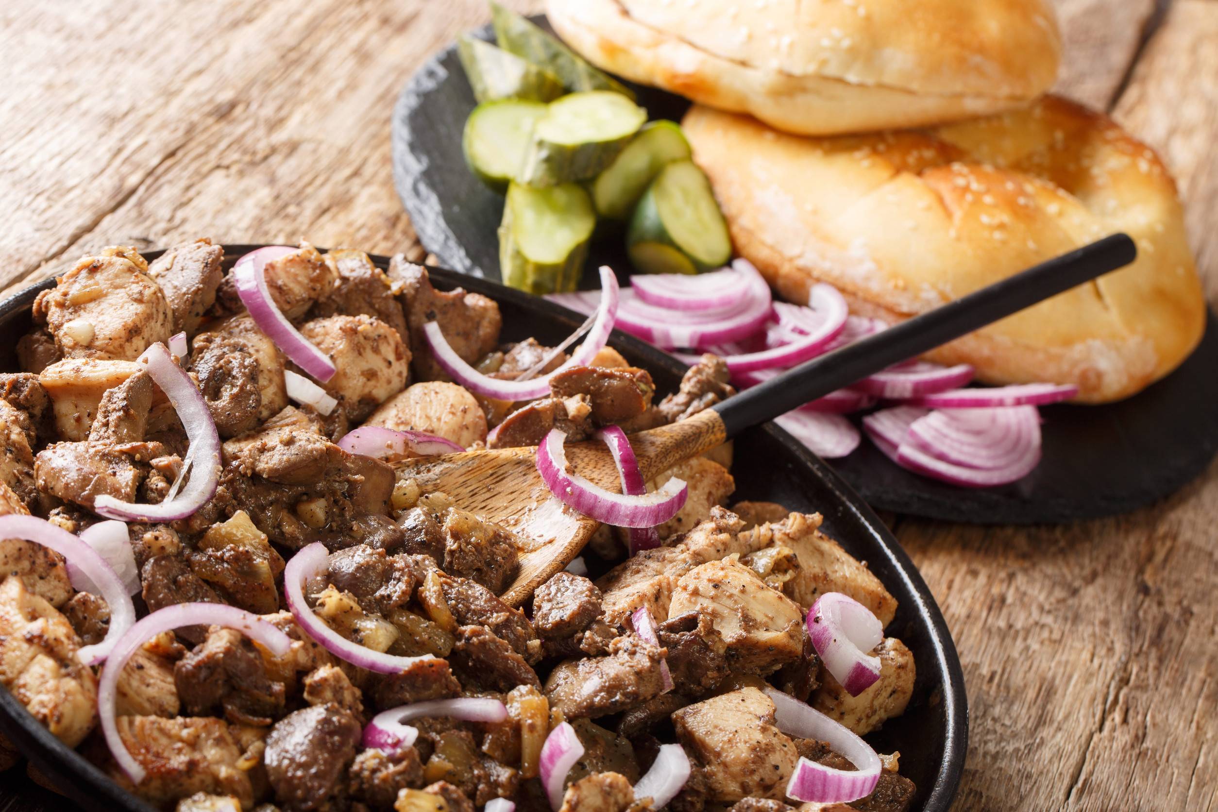 Jerusalem Mixed Grill Served With Pita Showing Spiced Chopped Meat And Grilled Onions